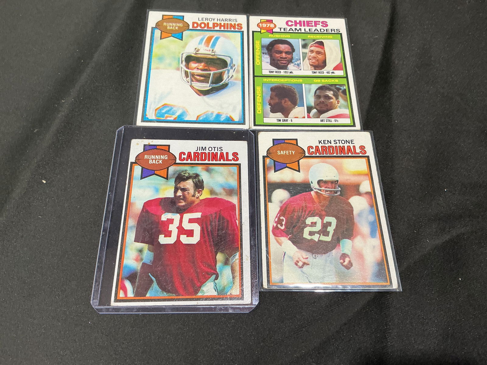 1979 Topps Football Card Lot Leroy Harris Jim Otis Ken Stone Chiefs Leaders: Group of four 1979 Topps football cards including Leroy Harris (Miami Dolphins), Jim Otis (St. Louis Cardinals), Ken Stone (Cardinals), and Kansas City Chiefs Team Leaders checklist card. Strong vinta