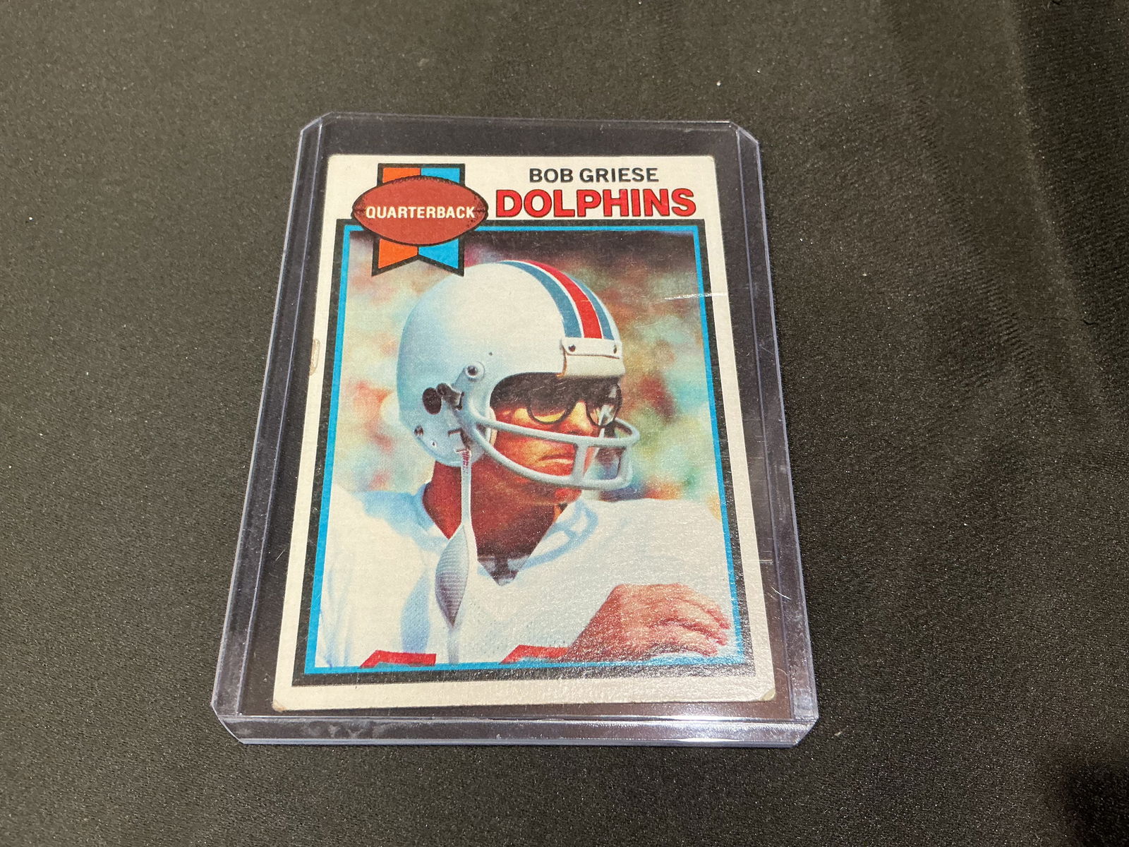 1979 Topps Bob Griese Miami Dolphins Football Card: 1979 Topps football card featuring Hall of Fame quarterback Bob Griese of the Miami Dolphins. Classic late-1970s Topps design highlighting one of the key figures of the Dolphins' historic era.