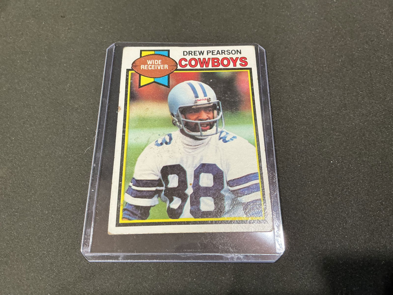 1979 Topps Drew Pearson Dallas Cowboys Football Card: 1979 Topps football card featuring Drew Pearson of the Dallas Cowboys. Classic late-1970s Topps design showing the All-Pro wide receiver in uniform. Back includes full career statistics and bio.