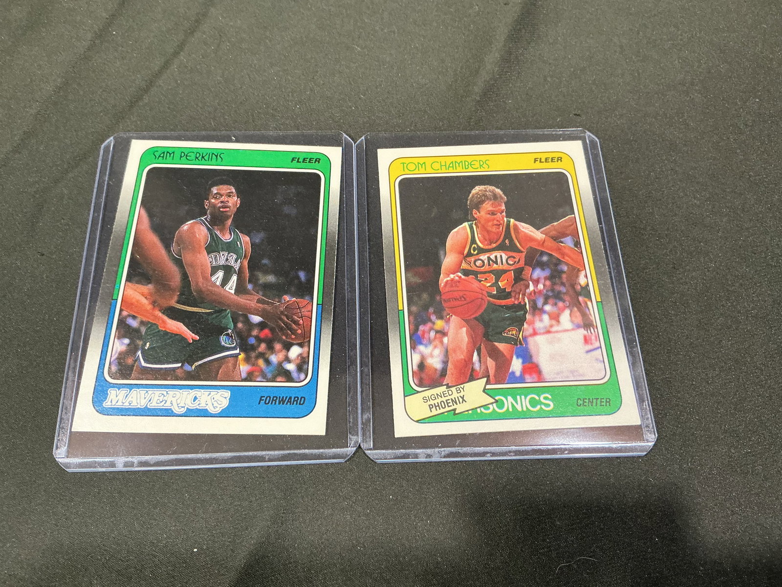 1988 Fleer Sam Perkins & Tom Chambers Basketball Cards (2): Pair of 1988 Fleer basketball cards featuring Sam Perkins Dallas Mavericks and Tom Chambers Seattle SuperSonics. Classic late-1980s Fleer design with player statistics on reverse.
