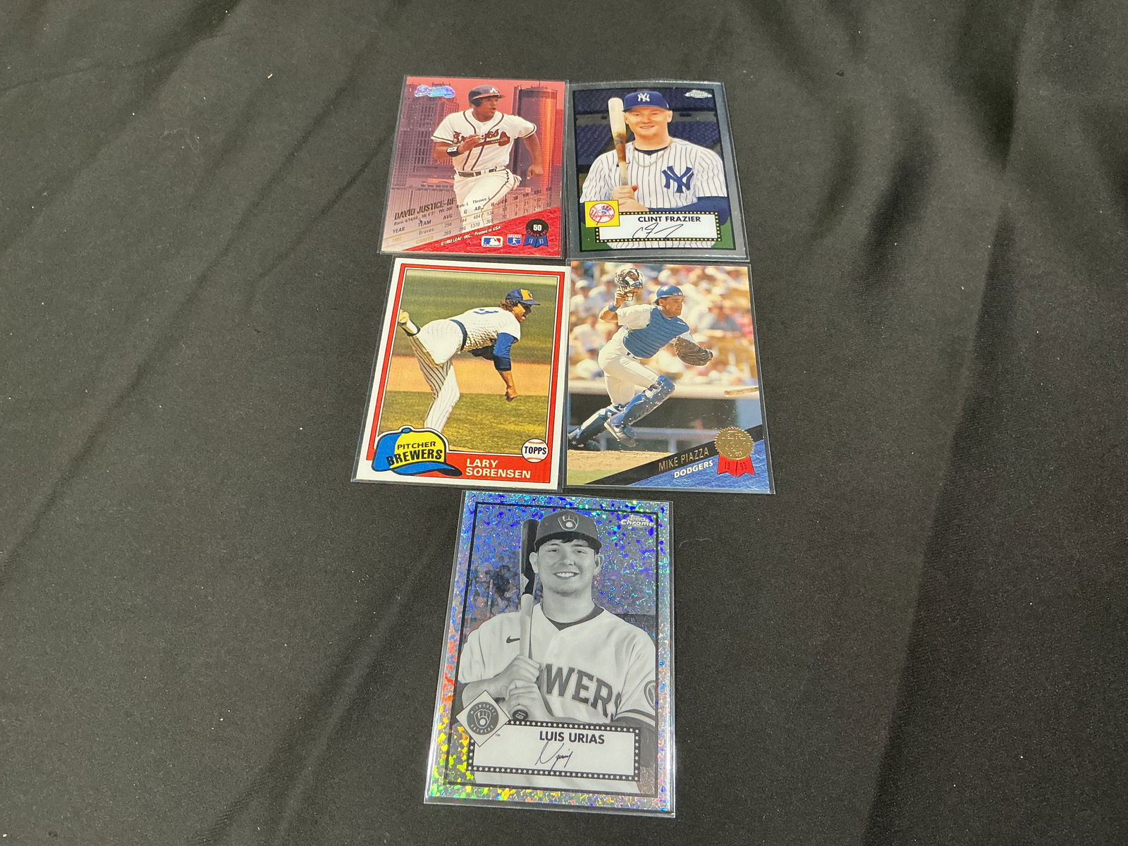 Mixed Baseball Card Group Including Mike Piazza and Luis Urias (5): Group of five baseball cards including Mike Piazza (Los Angeles Dodgers), Clint Frazier (New York Yankees), Lenny Dykstra (Philadelphia Phillies), Lary Sorensen (Milwaukee Brewers), and Luis Urias (Mi