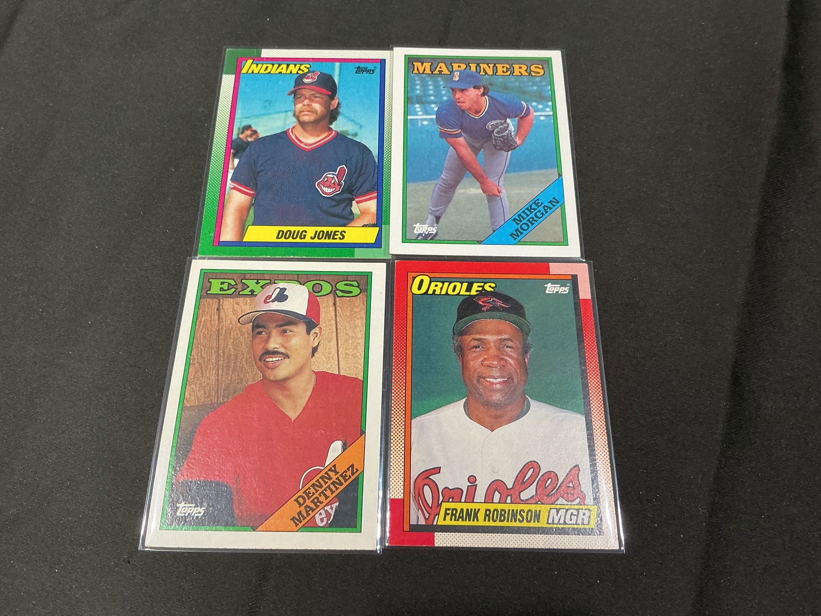 1989 Topps Baseball Card Group Including Frank Robinson and Denny Martinez (4): Group of four 1989 Topps baseball cards including Frank Robinson (Baltimore Orioles manager), Denny Martinez (Montreal Expos), Doug Jones (Cleveland Indians), and Mike Morgan (Seattle Mariners). Class