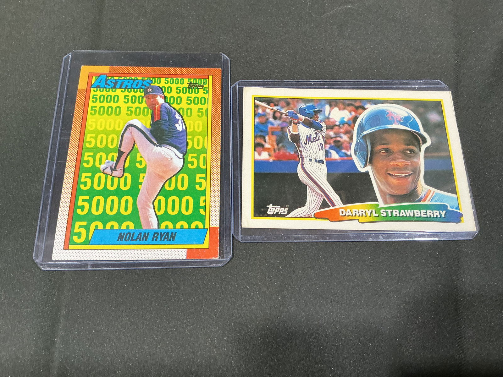 Topps Baseball Card Group Nolan Ryan Astros 5000 Strikeouts and Darryl Strawberry Mets: Two Topps baseball cards including Nolan Ryan Houston Astros '5000 strikeouts' milestone card and Darryl Strawberry New York Mets card featuring dual image front and illustrated reverse. Popular star