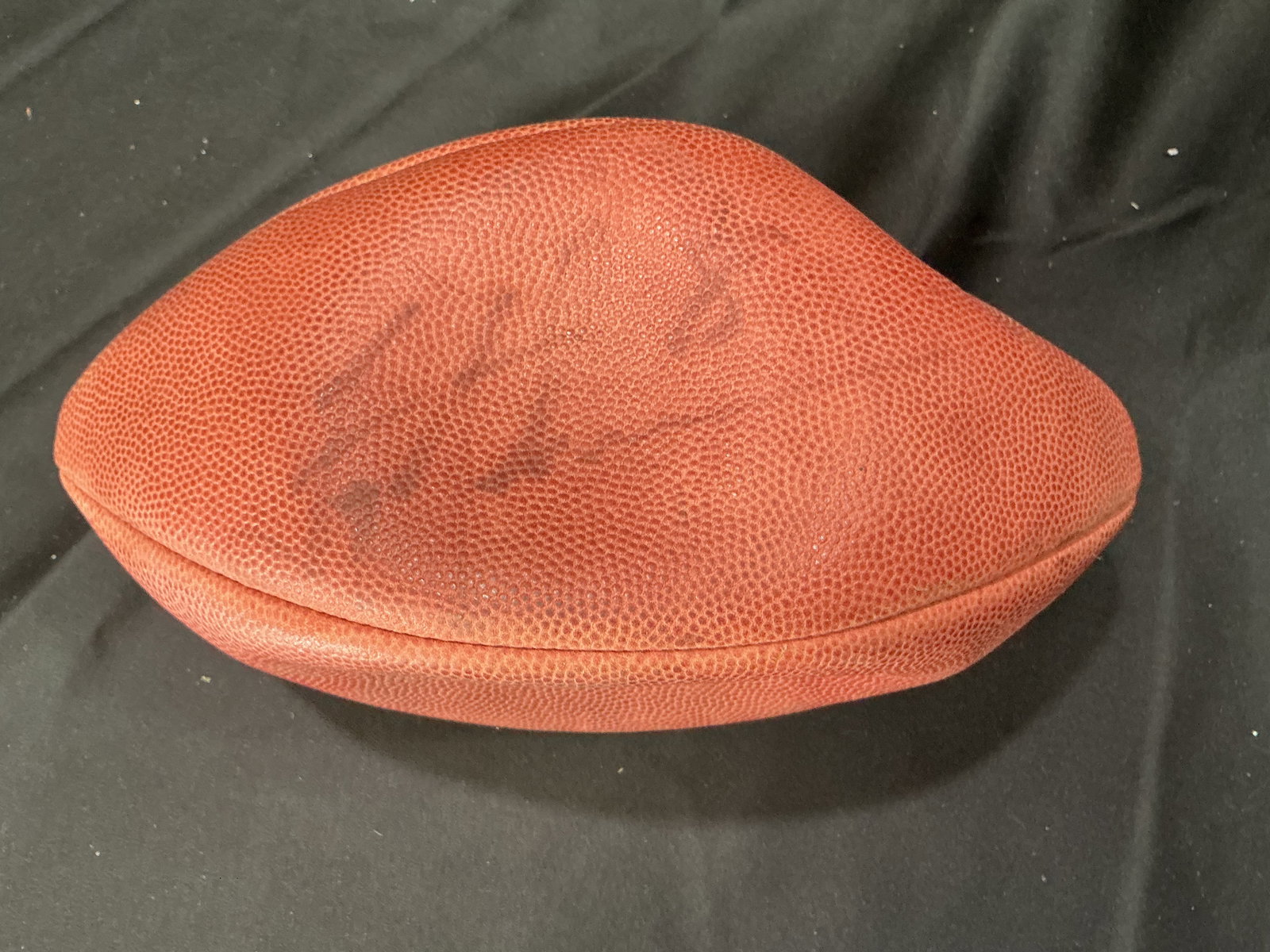 Wilson NFL Football Faded Autograph Troy Aikman #8: Wilson NFL game style football featuring a faded player autograph. Signature is present but heavily worn and difficult to identify. Official Wilson branding with classic pebbled leather construction.
