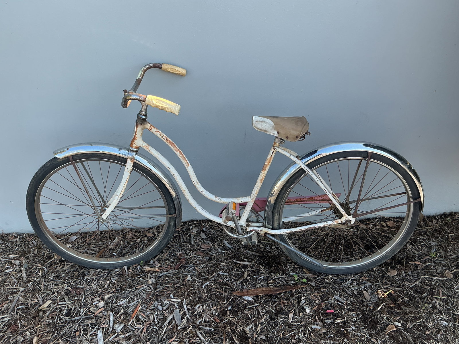 Vintage Schwinn Ladies Cruiser Bicycle Step Through: Vintage Schwinn ladies cruiser bicycle with classic step-through frame, chrome fenders, and strong nostalgic display appeal. A desirable project bike with decorative presence and restoration potential