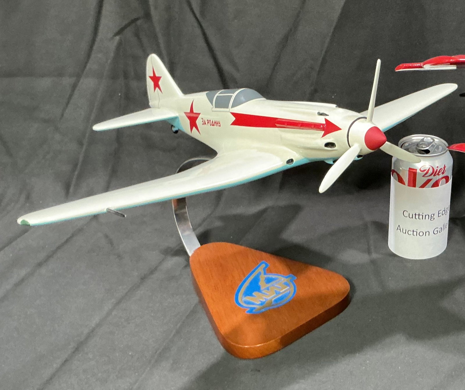 Soviet Yak Fighter Model Airplane on Display Stand: Presented again within this sports-heavy session, this Soviet Yak fighter model on stand provides a clean mid-catalog break from the sports material while keeping the overall session visually interest