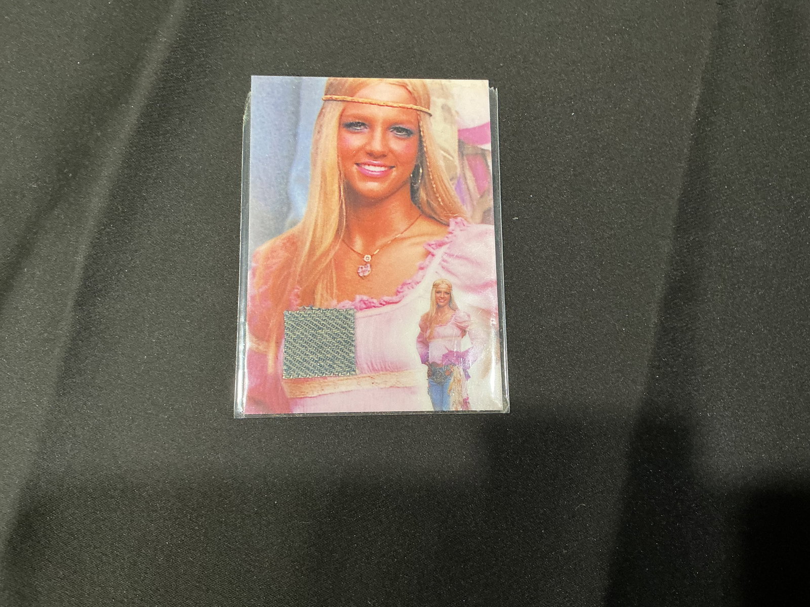 Britney Spears Certified Authentic Swatch Relic Card: Britney Spears collectible card featuring embedded swatch relic with Global Authentication certificate on reverse. Operation Swatch issue with serial verification.
