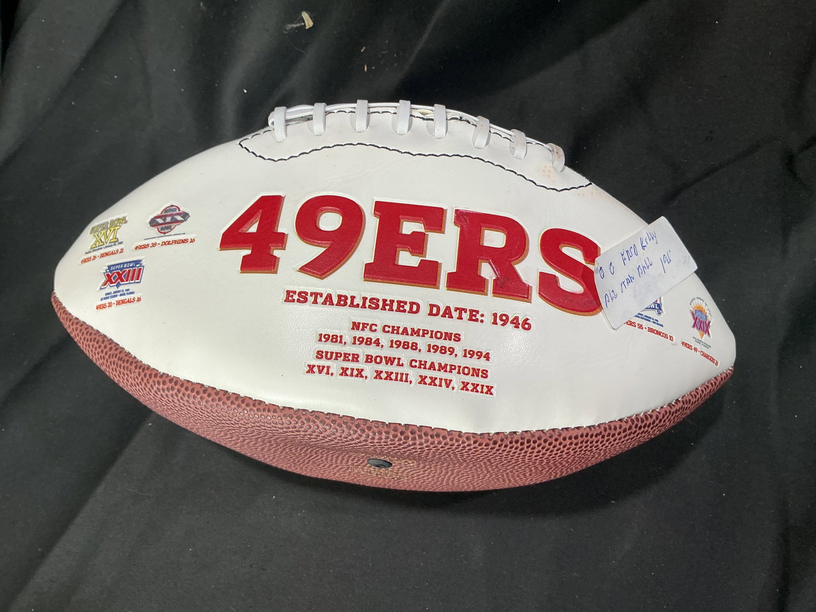 San Francisco 49ers Signed Football with Fred Kelly Inscription: Wilson San Francisco 49ers commemorative football featuring team graphics and multiple signatures, including a bold autograph with inscription attributed to Fred Kelly #55. Includes handwritten note r