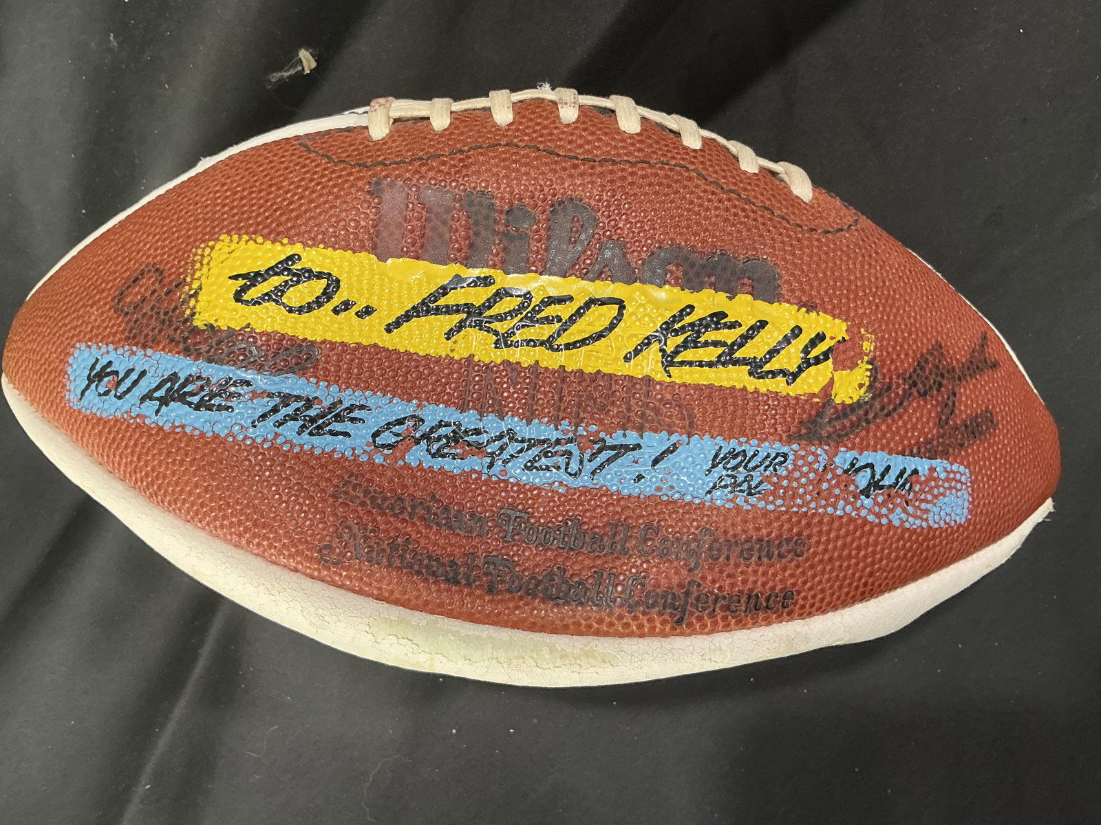 Fred Kelly Signed Wilson NFL Football AFC NFC Vintage: Wilson NFL football featuring multiple inscriptions including "To Fred Kelly" and "You are the greatest," along with an autograph. Displays AFC and NFC markings and vintage construction.