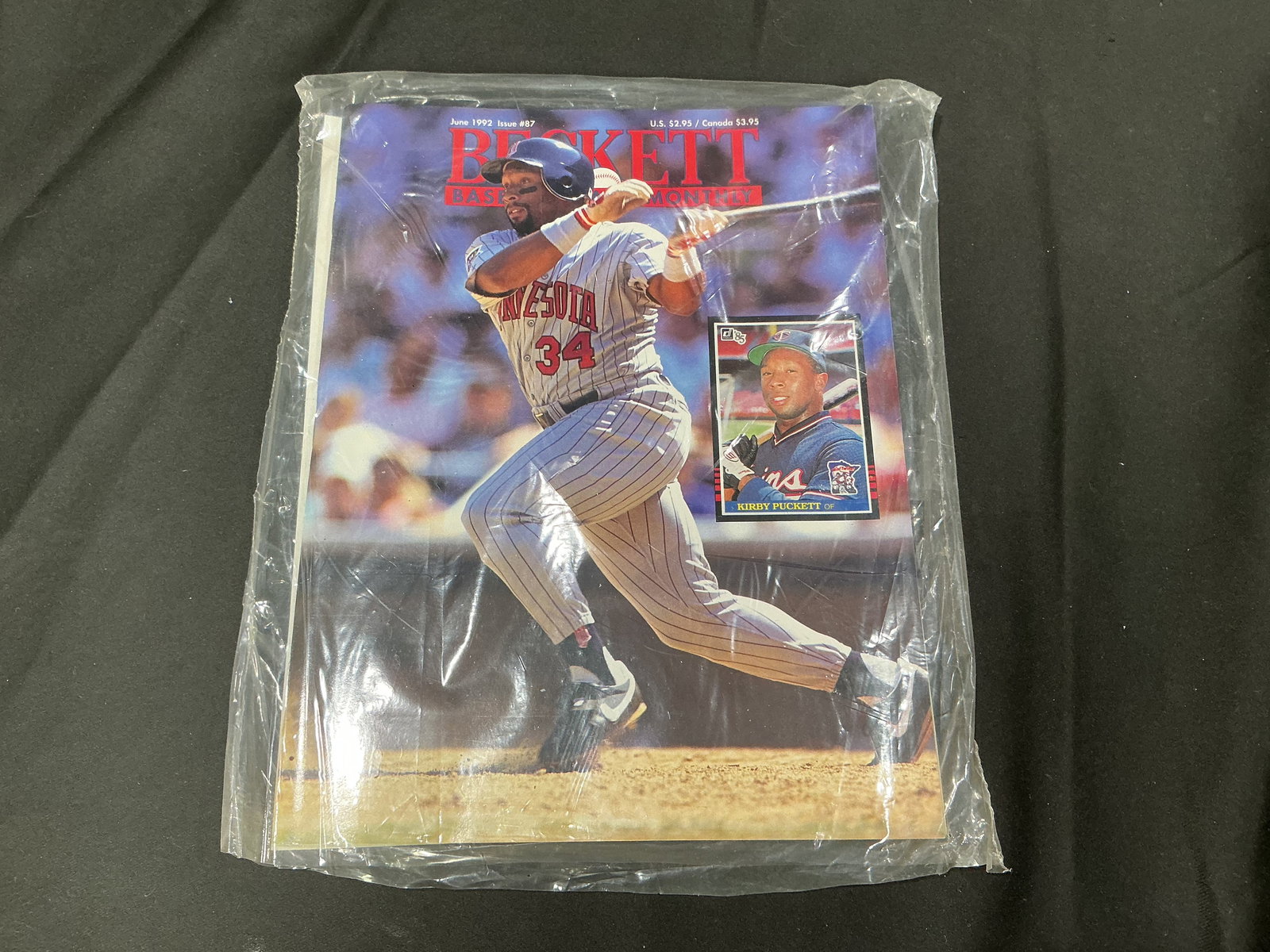 June 1992 Beckett Baseball Card Monthly Kirby Puckett Sealed: June 1992 issue of Beckett Baseball Card Monthly featuring Kirby Puckett on the cover. Original subscription mailer copy, still sealed in plastic. Includes mailing panel on reverse and has remained pr