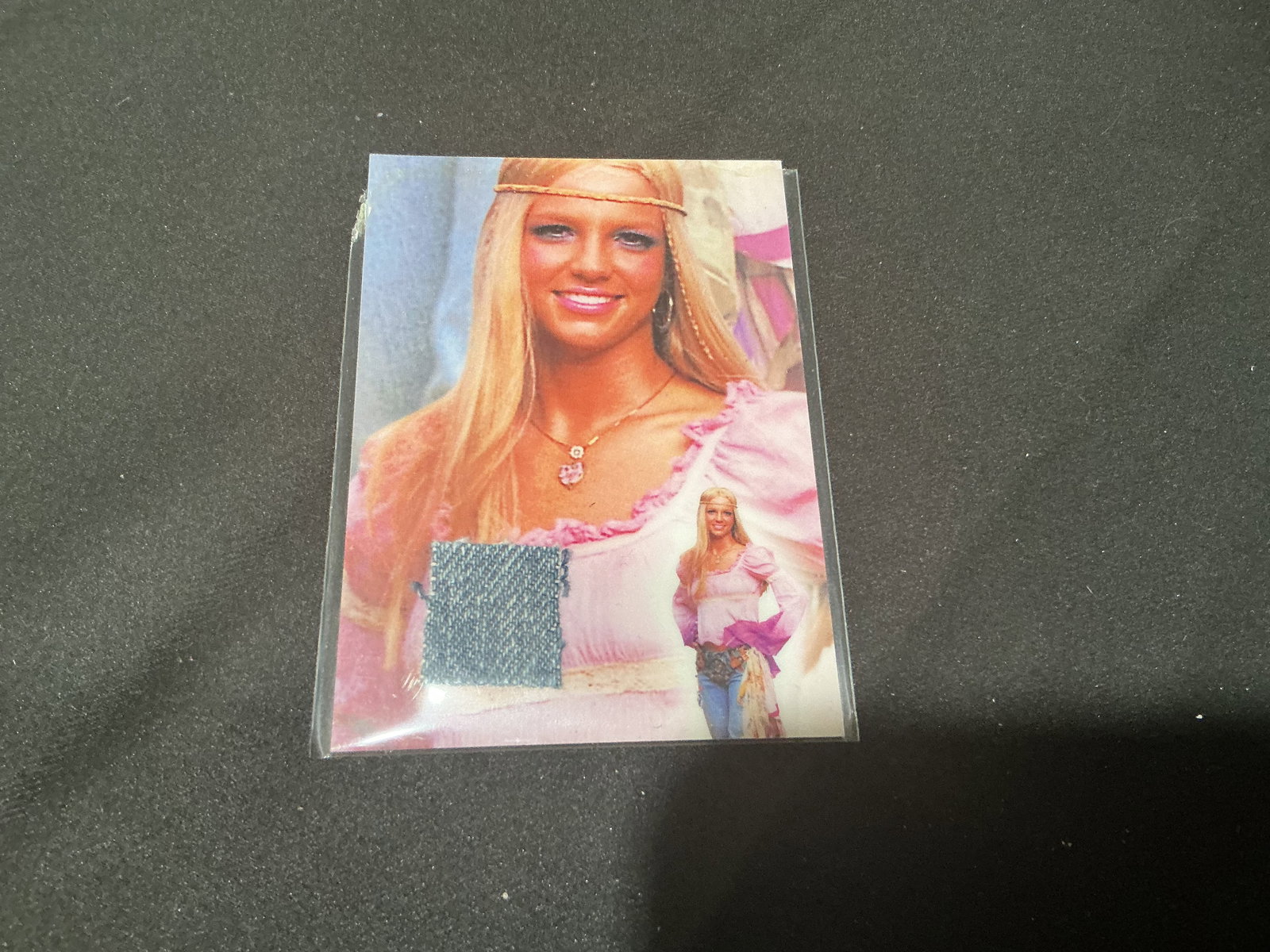 Britney Spears Memorabilia Swatch Card Certified Authentic: Certified Britney Spears memorabilia card featuring embedded fabric swatch with Global Authentication COA. Pop culture collectible tied to Operation Swatch program with certificate number visible. Uni