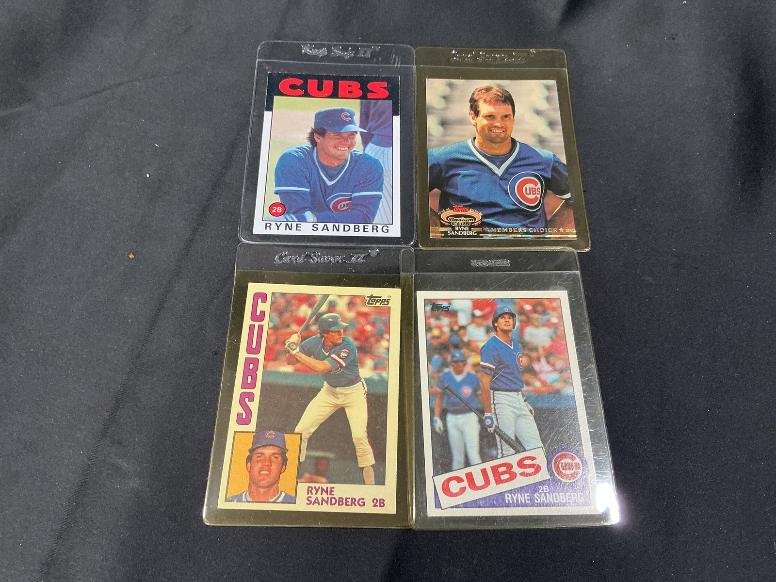 Ryne Sandberg Chicago Cubs Card Lot HOF: Group lot of Ryne Sandberg Chicago Cubs trading cards featuring multiple designs including Pinnacle, Studio, and Topps issues. Highlights one of the premier second basemen of his era and a Hall of Fam