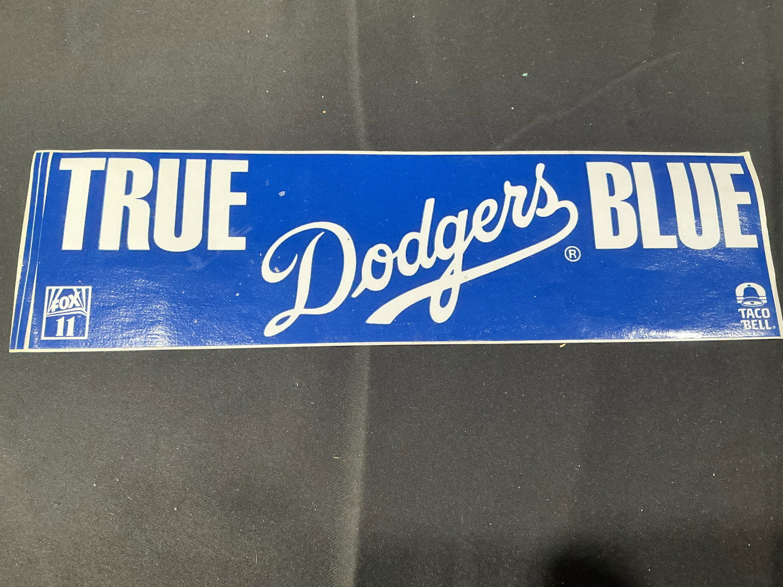 1991 True Blue Los Angeles Dodgers Taco Bell Sweepstakes Banner: 1991 True Blue Los Angeles Dodgers promotional sweepstakes banner issued through Taco Bell and KTTV Fox 11. Features bold Dodgers graphics with original reverse side entry form and official rules stil
