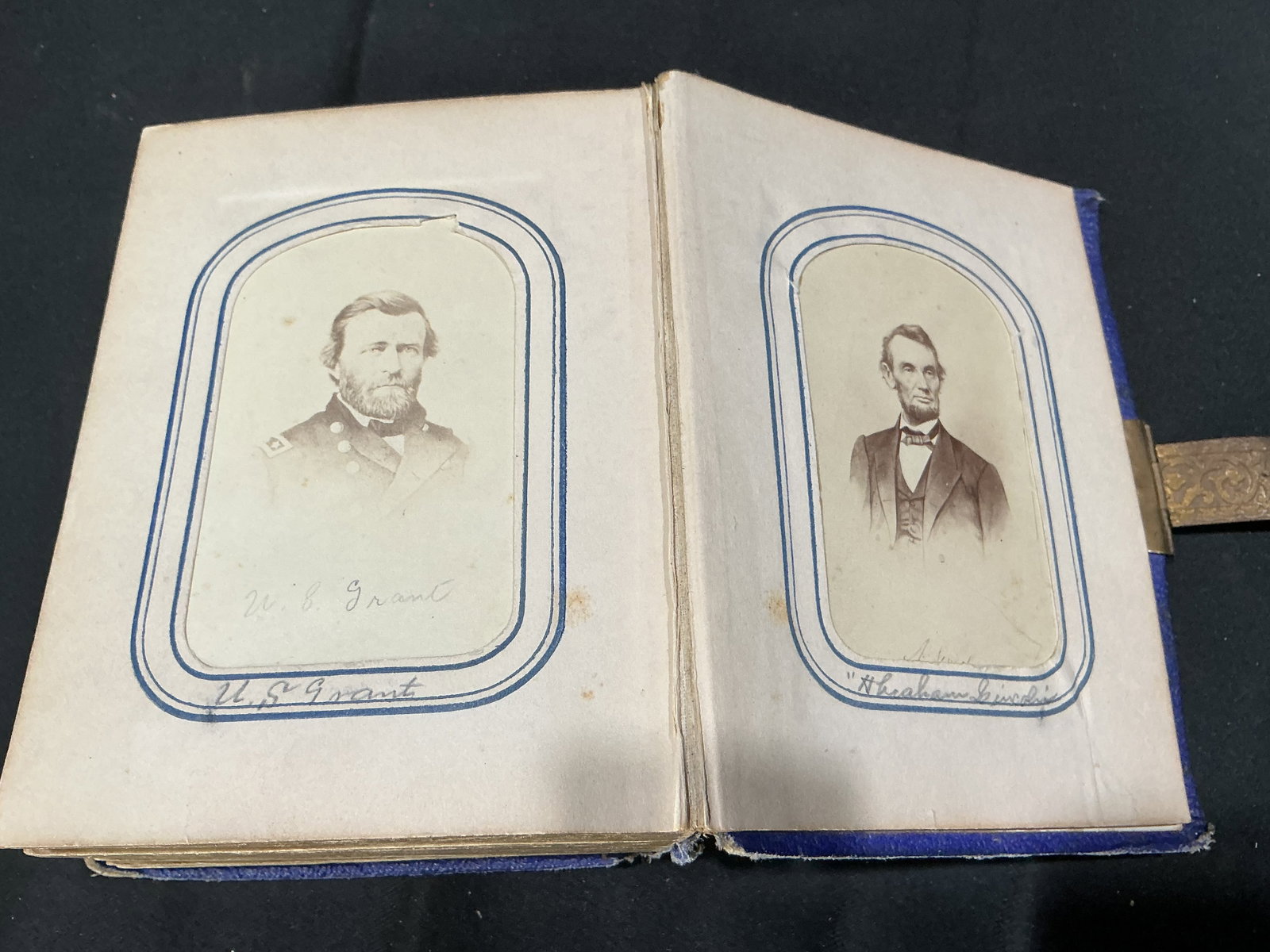 19th Century Civil War Portrait Album Lincoln Grant Davis: Ornate 19th century photograph album featuring Civil War era portraits identified as Abraham Lincoln, U.S. Grant, and Jefferson Davis alongside additional period family and studio photographs. Album r