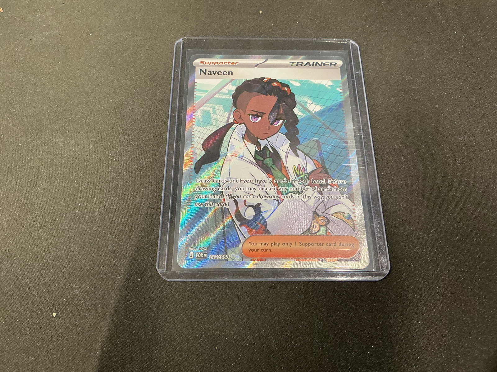 Pokemon Naveen Full Art Trainer Card Paldean Fates: Pokemon TCG full art Naveen supporter trainer card number 112/088 featuring textured foil finish and character artwork presentation from the modern Scarlet and Violet era. Previously run in prior even