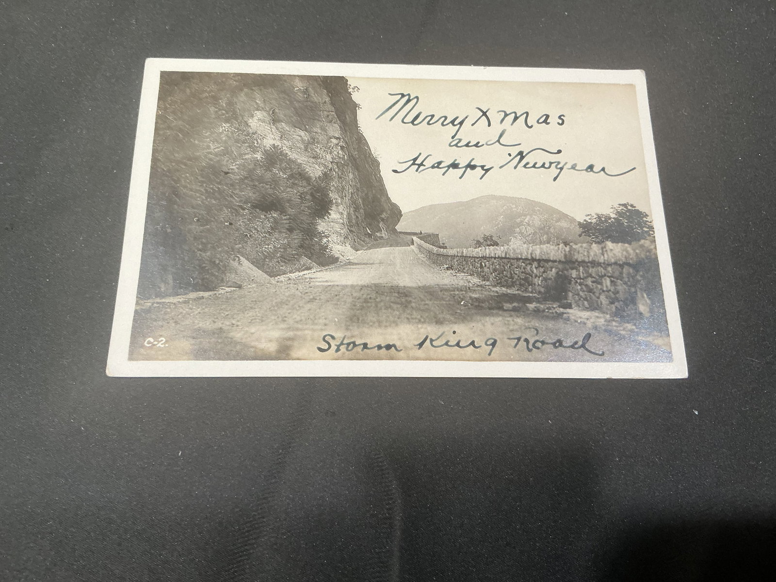 1914 Storm King Road Cornwall-on-Hudson NY Christmas Postcard: Another chance offering of this early 1914 real photo style postcard featuring Storm King Road near Cornwall-on-Hudson, New York with handwritten Merry Christmas and Happy New Year greeting. Postmarke