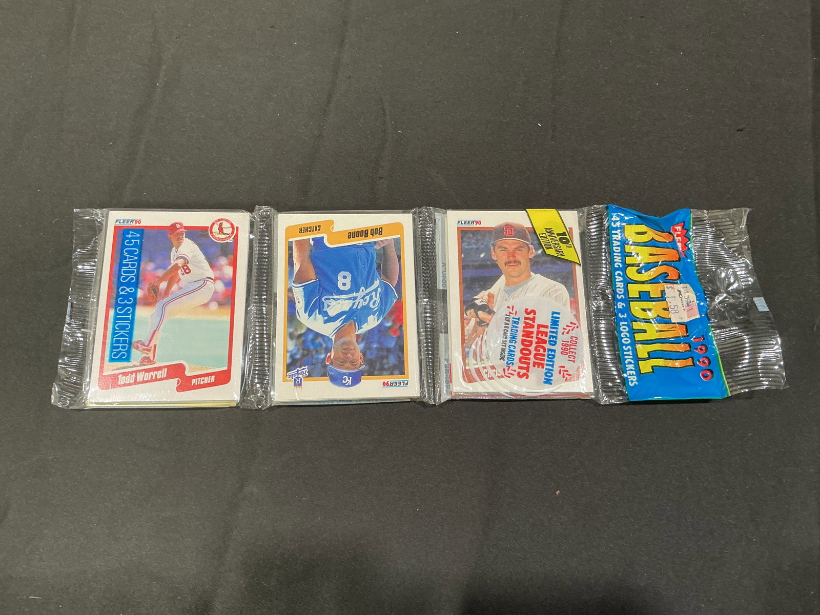 1990 Fleer Baseball Wax Pack Lot Worrell Boone Maldonado: Another chance offering of these three unopened 1990 Fleer baseball card wax packs featuring visible player cards including Todd Worrell, Bob Boone, and Melido Perez Maldonado. Factory sealed packs wi