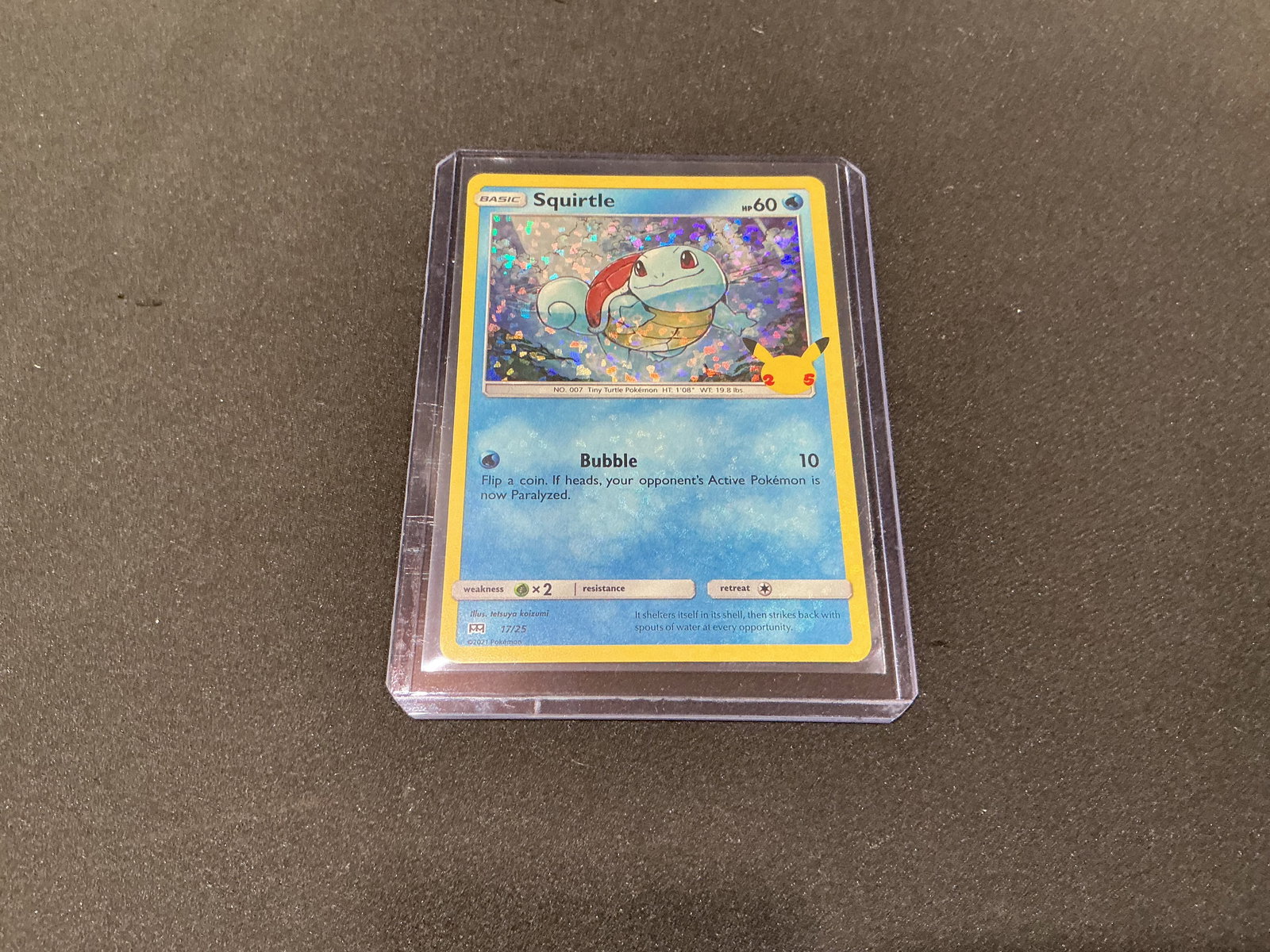 Pokemon McDonalds 25th Anniversary Squirtle Holo Card: Pokemon McDonalds 25th Anniversary holographic Squirtle promo card from the celebrated 2021 anniversary release. Features classic starter Pokemon artwork with confetti holo pattern and strong nostalgi