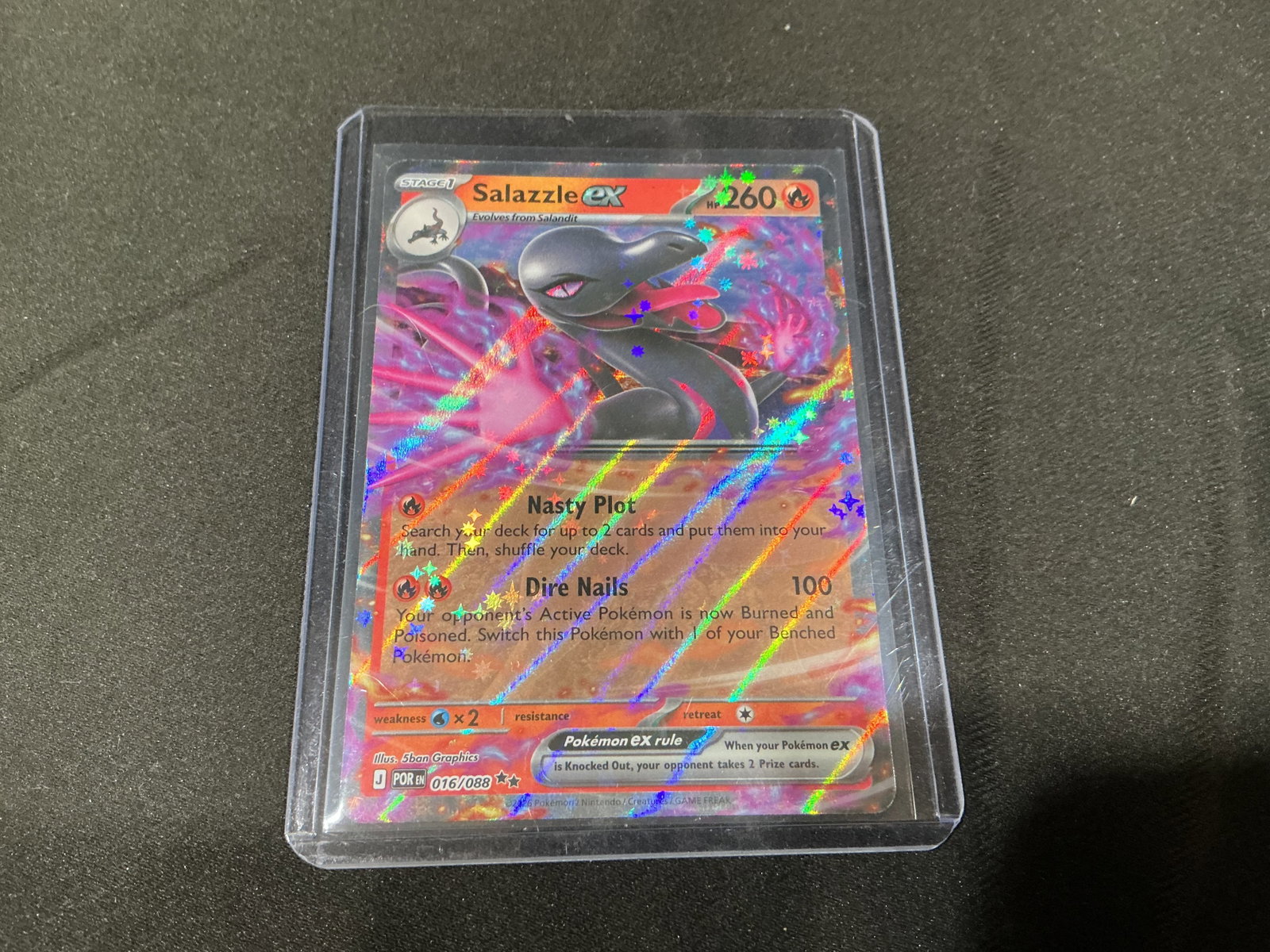 Pokemon Salazzle ex Full Art Holo Card 016/088: Pokemon Salazzle ex full art holo trading card numbered 016/088 featuring vivid foil finish and modern Scarlet and Violet era artwork. Strong visual presentation with collector appeal for Pokemon ex