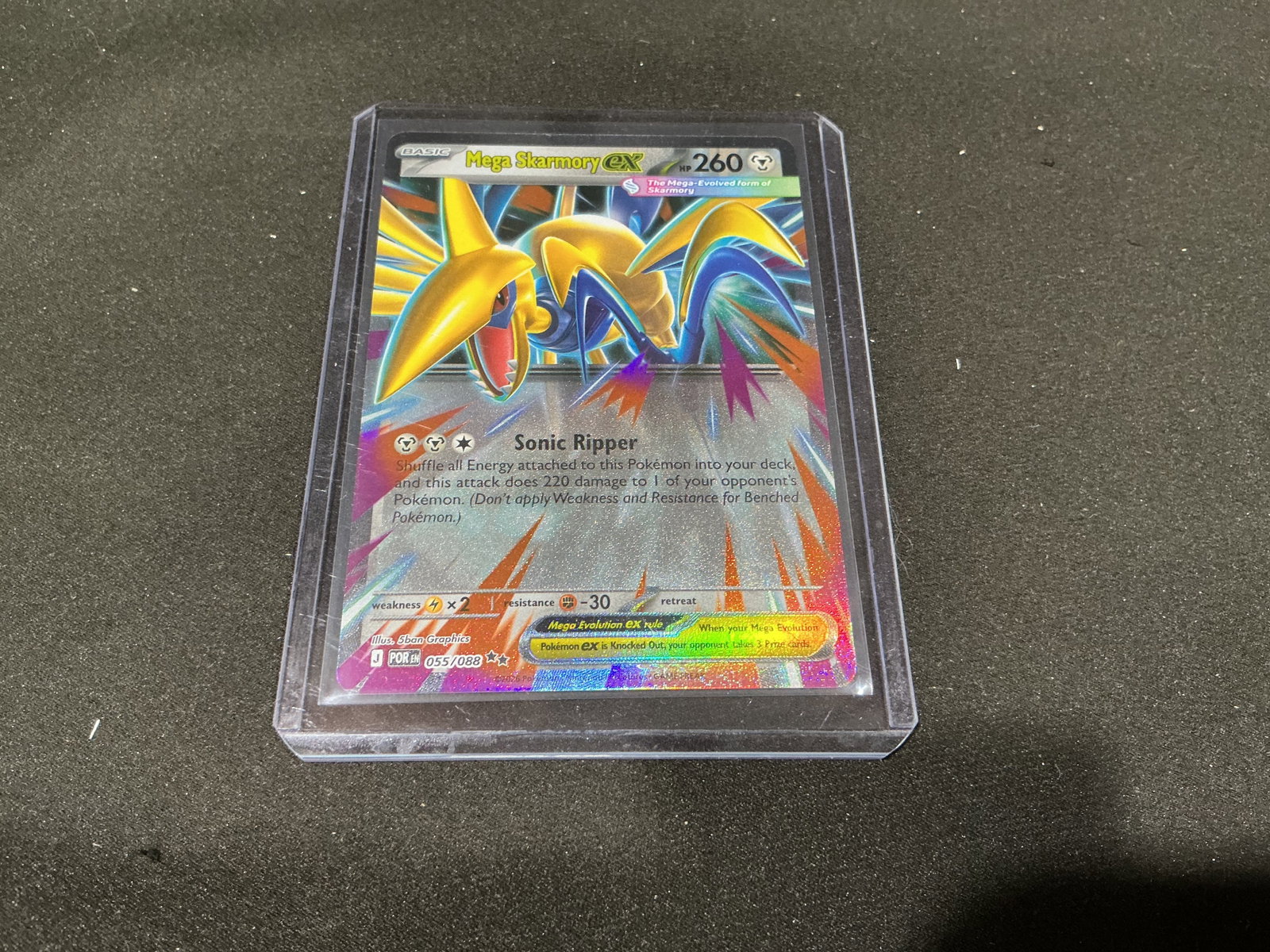 Pokemon Mega Skarmory EX Full Art Holo Card: Pokemon Mega Skarmory EX full art holographic trading card featuring vibrant modern artwork and foil finish. Sleeved and cased presentation with strong appeal for Pokemon collectors and competitive er