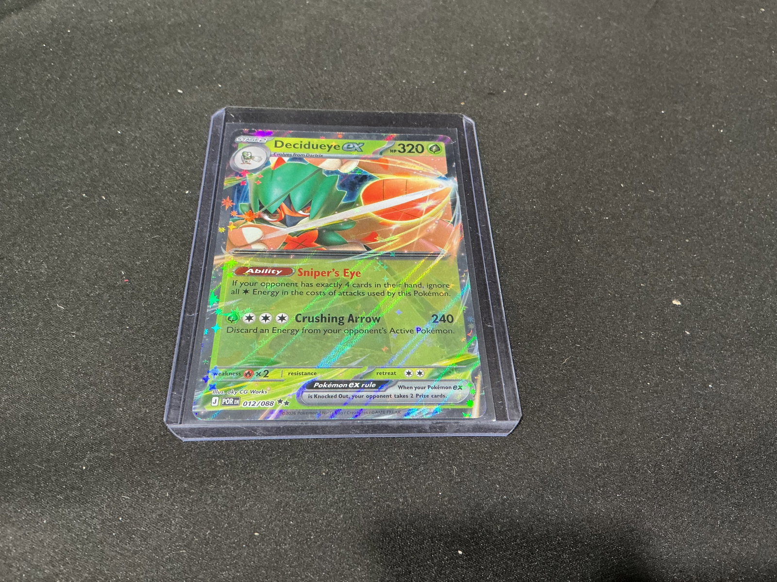 Pokemon Decidueye ex Holo Card 012/088: Pokemon Decidueye ex holographic trading card from the Mega Evolution Perfect Order series. Features full art style presentation with vivid foil finish and protective holder display.