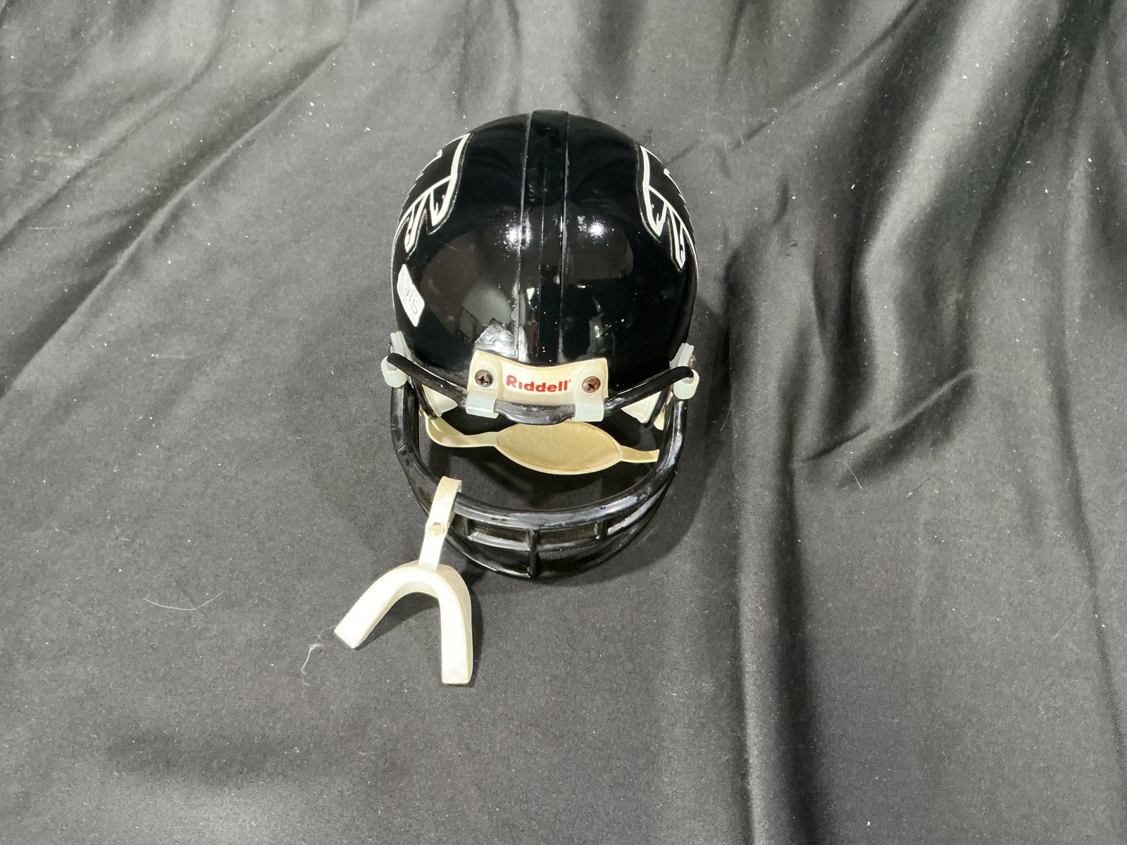 Atlanta Falcons Riddell Mini Football Helmet Display: Atlanta Falcons Riddell mini football helmet display piece featuring classic Falcons logo and black shell design. Great desk, shelf, or sports memorabilia collection display item for NFL fans.