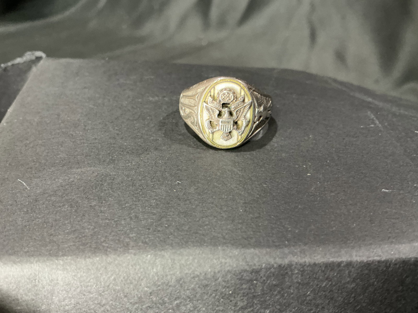 Vintage Military Style Eagle Crest Ring: Vintage military style ring featuring eagle crest emblem design with aged patina and detailed side accents. A collectible patriotic accessory with classic military-inspired presentation.