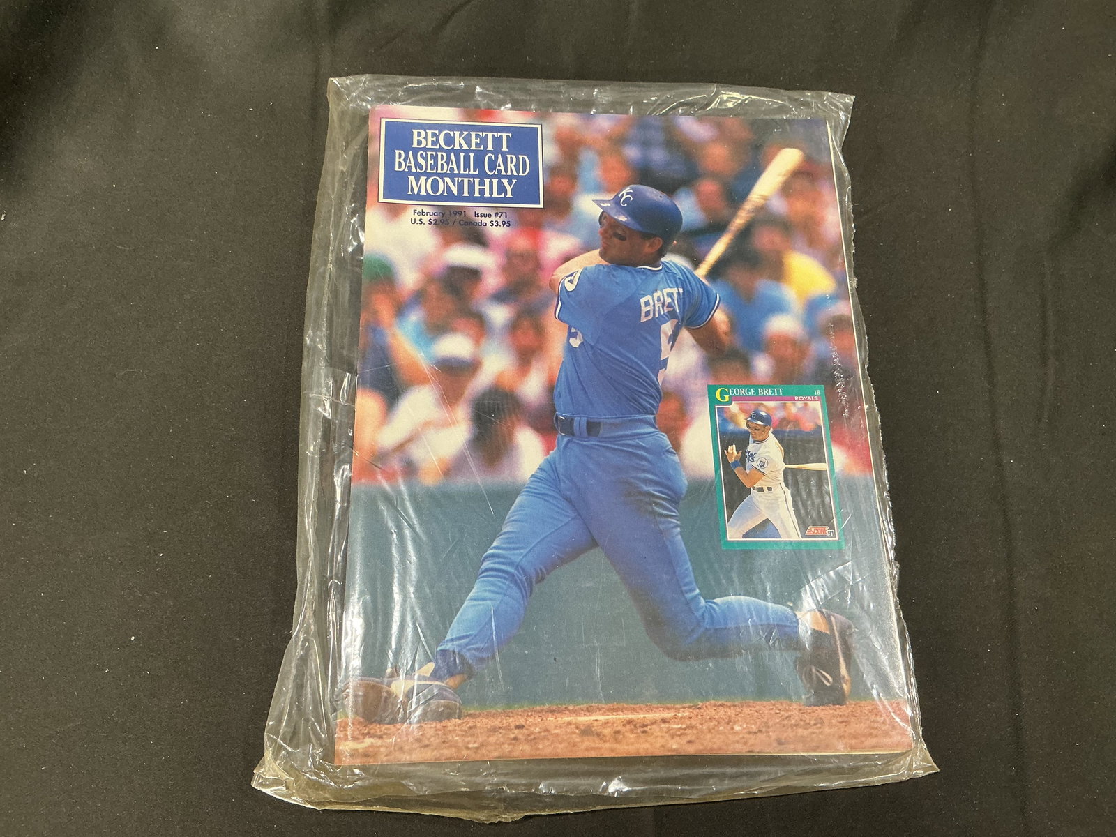 1991 Beckett Baseball Card Monthly George Brett Issue Sealed: Sealed February 1991 Beckett Baseball Card Monthly Issue #71 featuring Hall of Famer George Brett on the cover. Vintage hobby publication with period pricing, collecting coverage, and baseball card