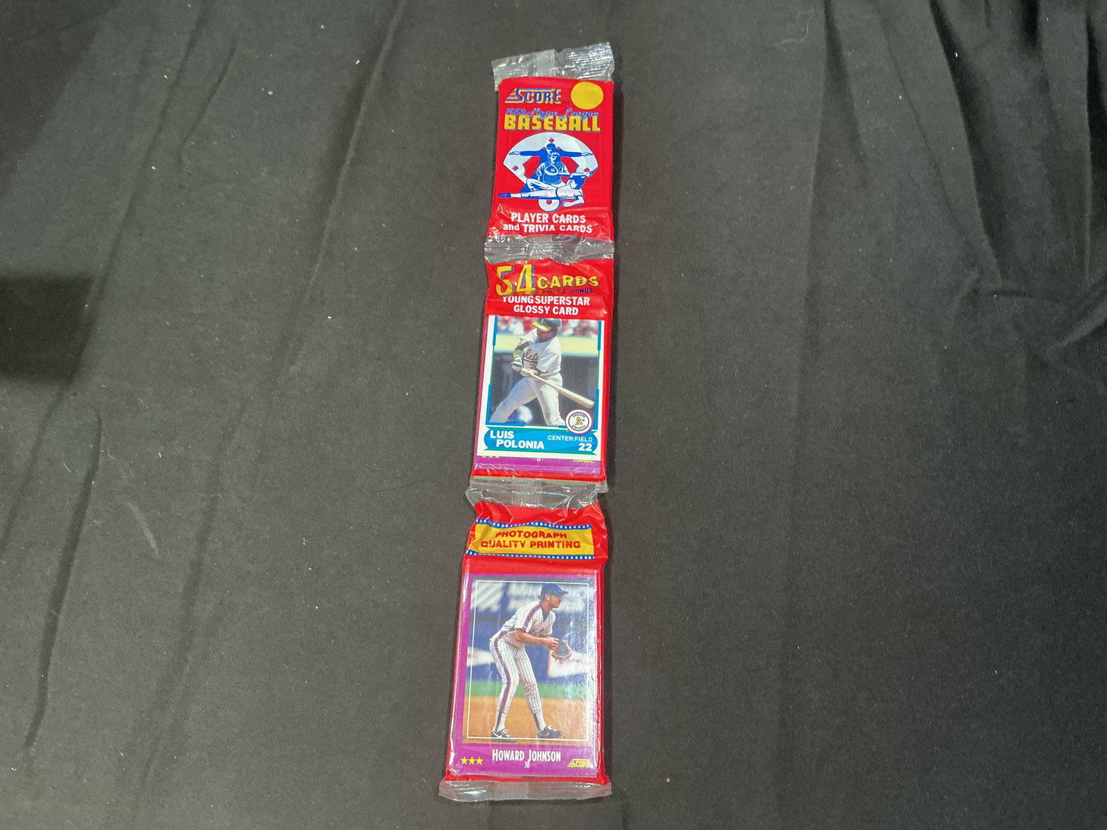 1990 Score Baseball Wax Pack with Glossy Bonus Card Sealed: Factory sealed 1990 Score Baseball wax pack containing 54 cards plus bonus young superstar glossy card. Vintage unopened baseball product from the early 1990s featuring MLB stars, rookies, and inserts