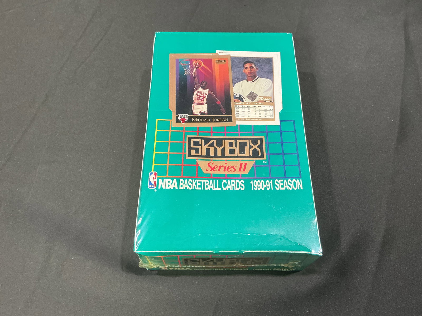 1990-91 SkyBox Series II NBA Basketball Sealed Box: Factory sealed 1990-91 SkyBox Series II NBA Basketball card box featuring stars of the era including Michael Jordan and other Hall of Fame legends. Popular colorful early SkyBox release with strong