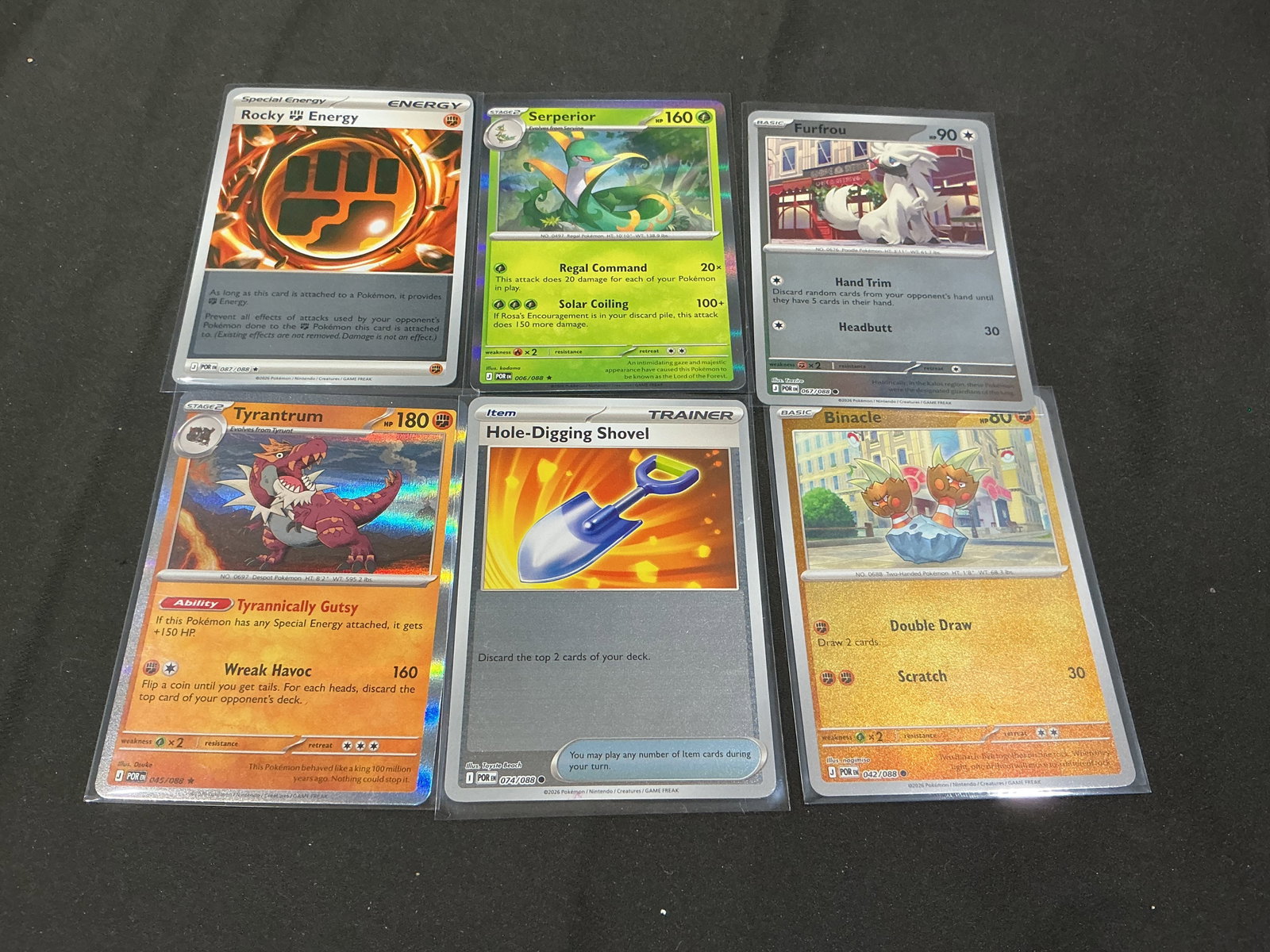 Pokemon Reverse Holo Card Lot Rocky Energy Tyrantrum More: Pokemon trading card lot featuring reverse holo and standard cards including Rocky Energy, Tyrantrum, Serperior, Furfrou, Binacle, and Hole-Digging Shovel. Modern mixed assortment with colorful