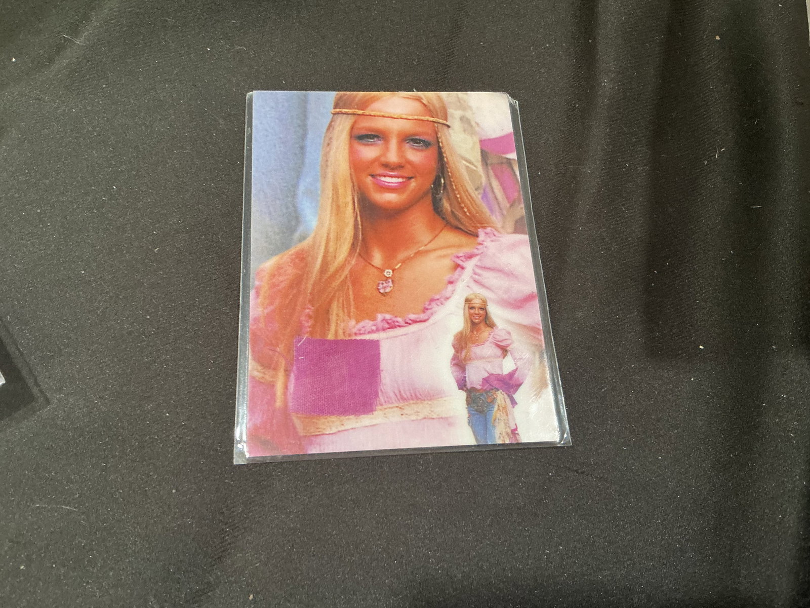 Britney Spears Authentic Swatch Relic Card Collector Piece Another Chance Returning Collector: Britney Spears collectible swatch relic card featuring embedded fabric piece and Global Authentication certificate details on reverse. Pop culture and music memorabilia crossover collectible tied to o