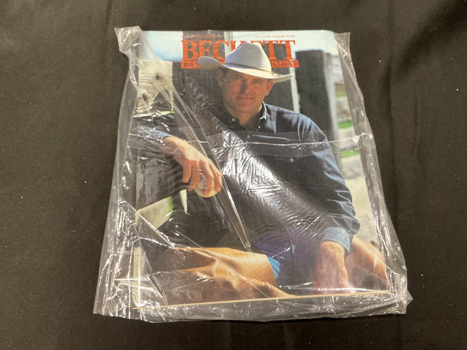 Beckett Baseball Card Monthly Nolan Ryan Ranch Issue Sealed Mailer: Vintage Beckett Baseball Card Monthly magazine still sealed in original mailer featuring retired Nolan Ryan photographed on his Texas ranch. Collectible sports publication with strong appeal for