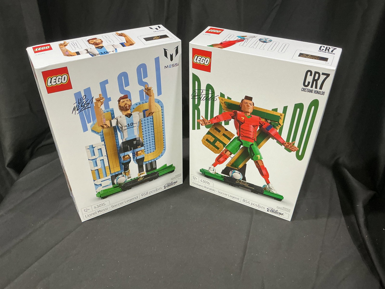 LEGO Lionel Messi & Cristiano Ronaldo Soccer Legend Set Pair Repeat Offering Returning Collector: Pair of large format LEGO soccer legend display sets featuring Lionel Messi and Cristiano Ronaldo. Includes LEGO Messi Soccer Legend set 43015 with 958 pieces and LEGO CR7 Cristiano Ronaldo Soccer