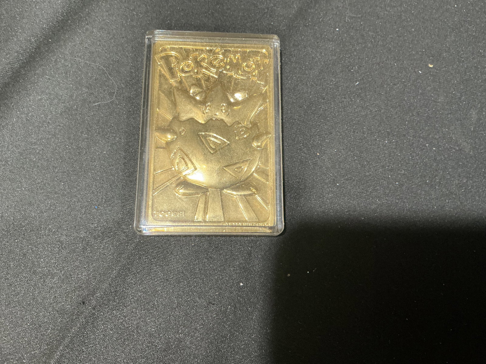 1999 Burger King Pokemon Gold Togepi Promo Card: 1999 Burger King Pokemon gold metal promo card featuring Togepi in raised embossed style with mirrored gold tone finish. Released during the height of the original Pokemon craze as part of the Burger