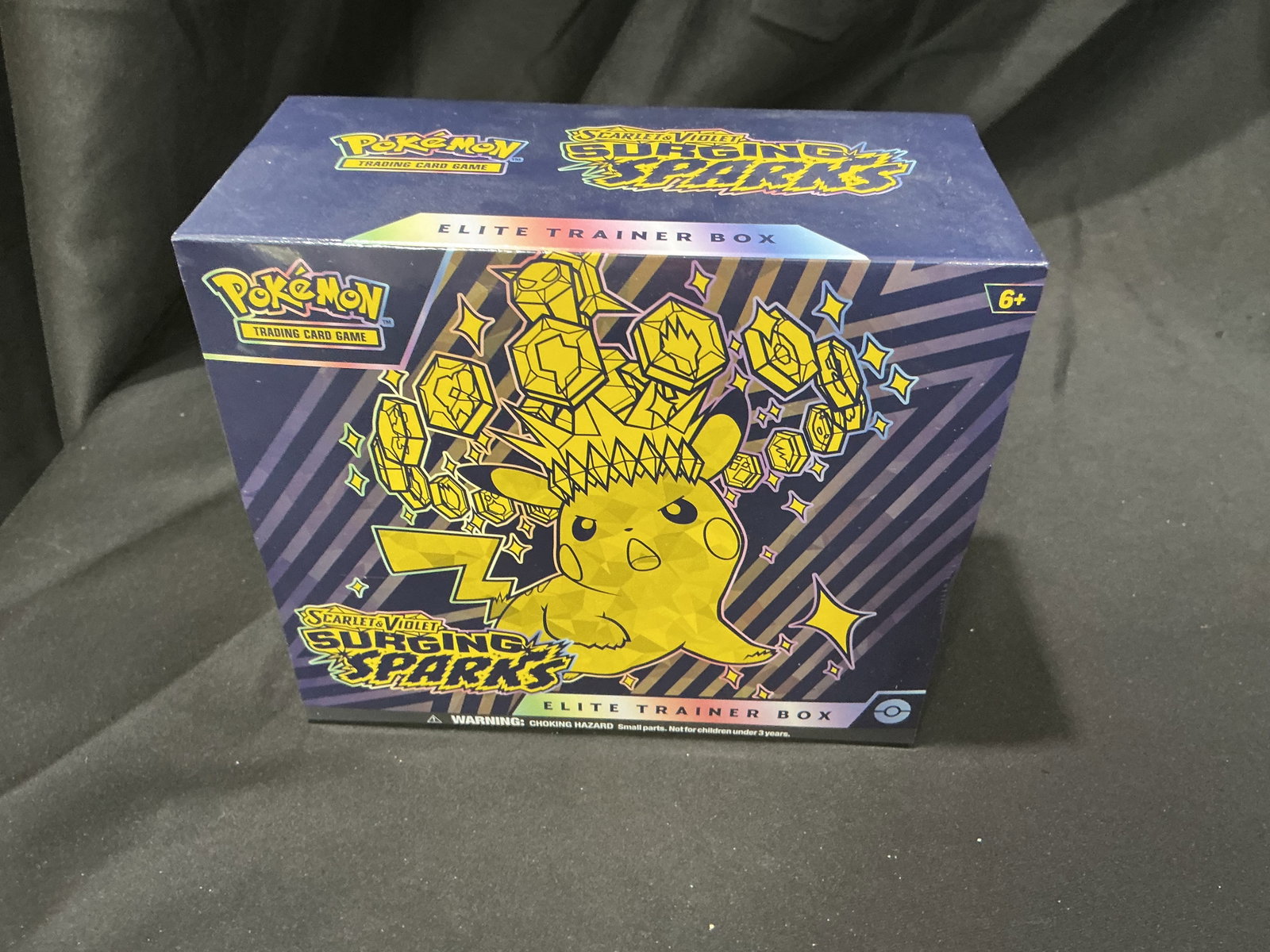 Pokemon Scarlet & Violet Surging Sparks Elite Trainer Box Sealed Pikachu: Factory sealed Pokemon Scarlet & Violet Surging Sparks Elite Trainer Box featuring Pikachu artwork and Surging Sparks booster packs. Includes booster packs, promo card, sleeves, energy cards, dice, ma