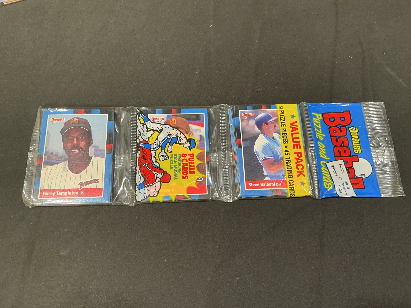 1989 Donruss Baseball Puzzle And Cards Value Packs Lot: Returning lot that has run before, featuring sealed 1989 Donruss Baseball Puzzle and Cards value packs with visible player cards including Garry Templeton, Eric Show and Steve Balboni. Each pack