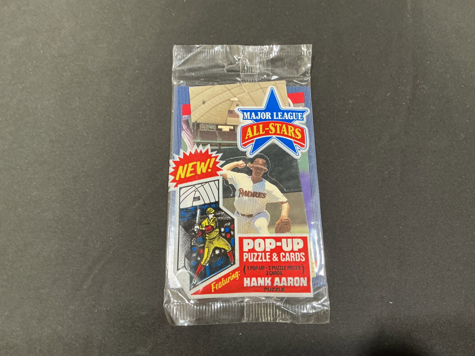 Major League All-Stars Hank Aaron Pop-Up Puzzle Cards Pack: Sealed Major League All-Stars pop-up puzzle and cards pack featuring Hank Aaron. Vintage baseball collectible with unopened presentation and colorful period graphics. A fun returning wax-era novelty i