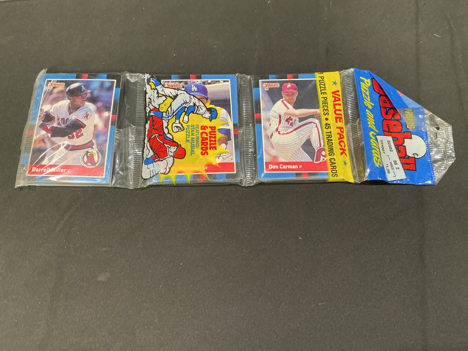 1988 Donruss Baseball Puzzle & Cards Value Pack Sealed: 1988 Donruss Baseball Puzzle and Cards value pack featuring sealed vintage trading card contents with visible Darrell Miller and Don Carman cards. Includes puzzle piece insert and classic late-1980s D