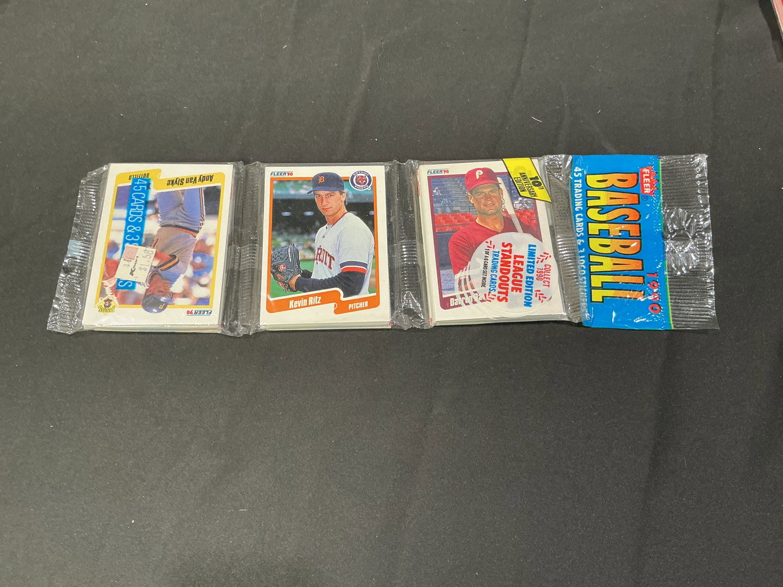 1990 Fleer Baseball Rack Pack Sealed Wax Pack featuring Kevin Ritz: Sealed 1990 Fleer Baseball rack pack featuring 45 trading cards and 3 logo stickers. Vintage unopened baseball wax presentation with classic MLB player lineup and nostalgic card collecting appeal. Est