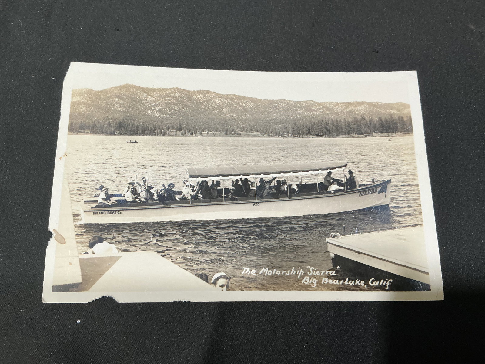 Vintage Big Bear Lake California Motorship Sierra RPPC: Vintage real photo postcard featuring the Motorship Sierra touring Big Bear Lake, California. Classic lakeside transportation and tourism scene showing passengers aboard the Inland Boat Co. vessel