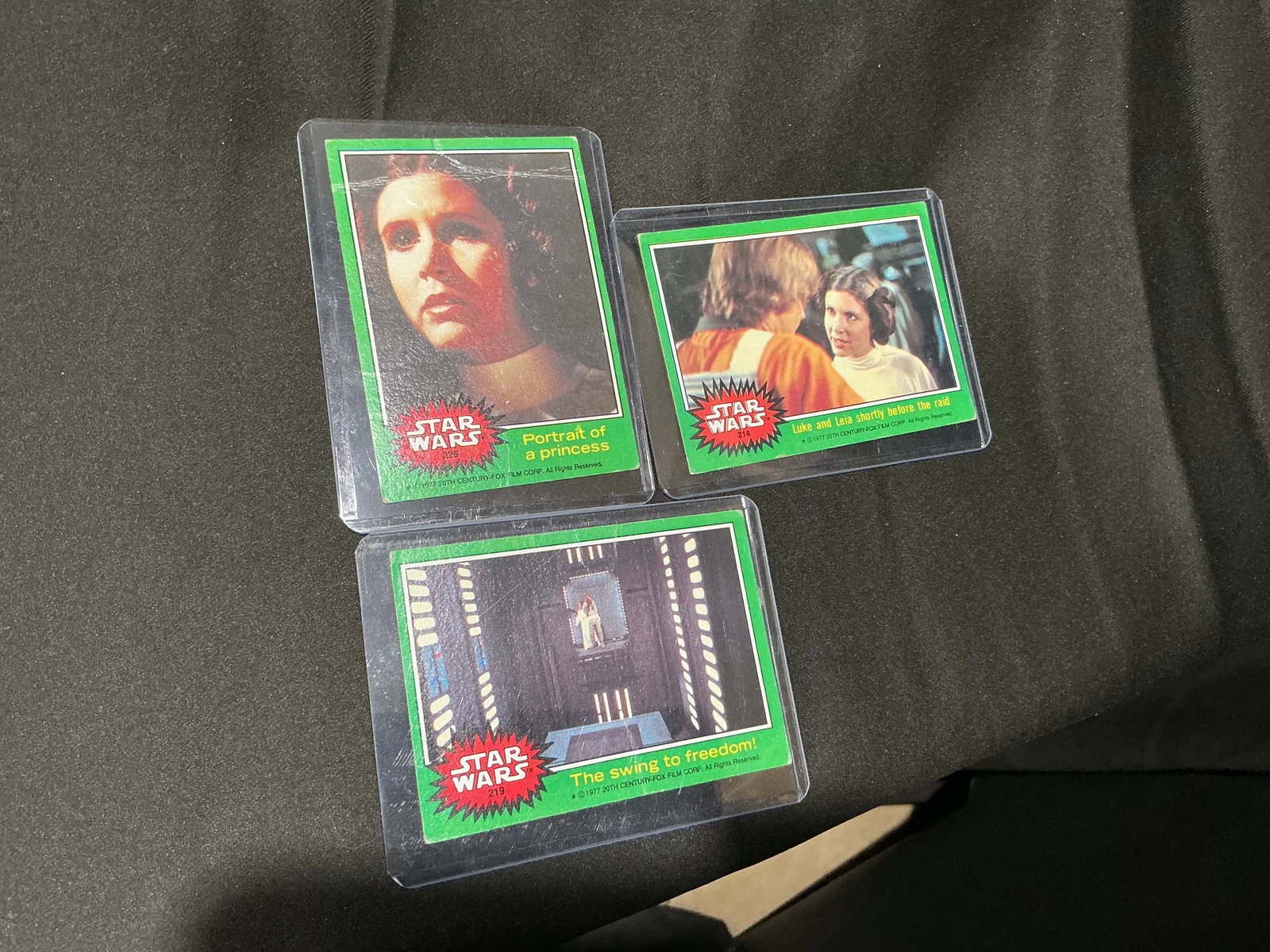 1977 Star Wars Trading Card Lot Princess Leia Green Series Cards: Previously featured example returning to auction featuring a small lot of vintage 1977 Star Wars trading cards including Princess Leia and scene cards from the original film era. Green border series