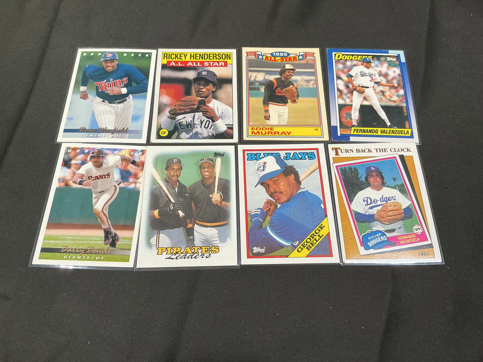 1980s Baseball Stars Card Lot Barry Bonds Rickey Henderson Eddie Murray: Returning baseball star lot featuring Barry Bonds, Rickey Henderson, Eddie Murray, Fernando Valenzuela, Dave Winfield, George Bell, and other recognizable names from the 1980s and early 1990s. Strong 