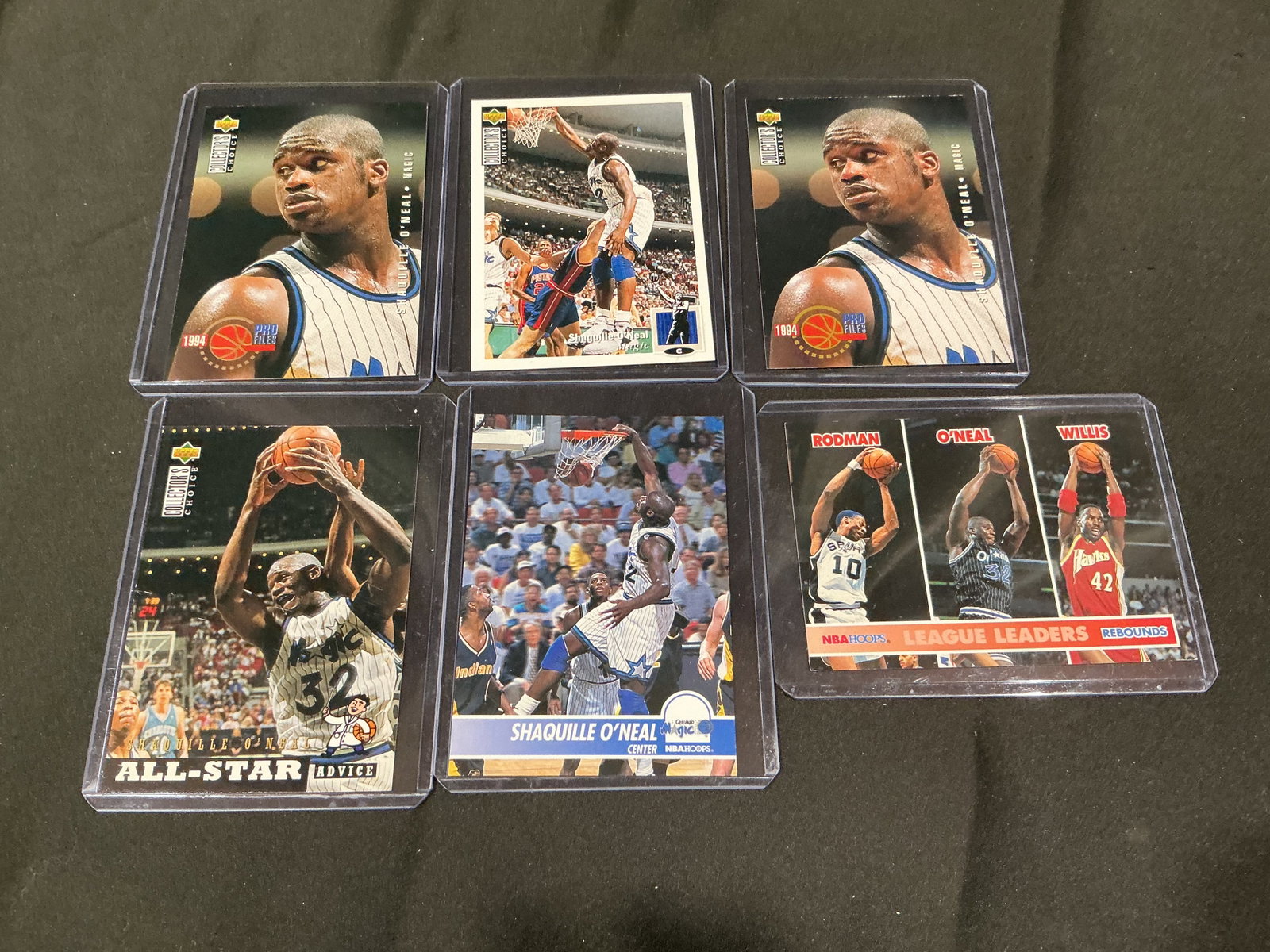 Shaquille O'Neal Basketball Card Collection Group of 6: Six-card Shaquille O'Neal collection featuring Upper Deck, NBA Hoops, Collector's Choice, Pro Files, and league leader issues. Returning offering from a prior auction, with similar sports card groups