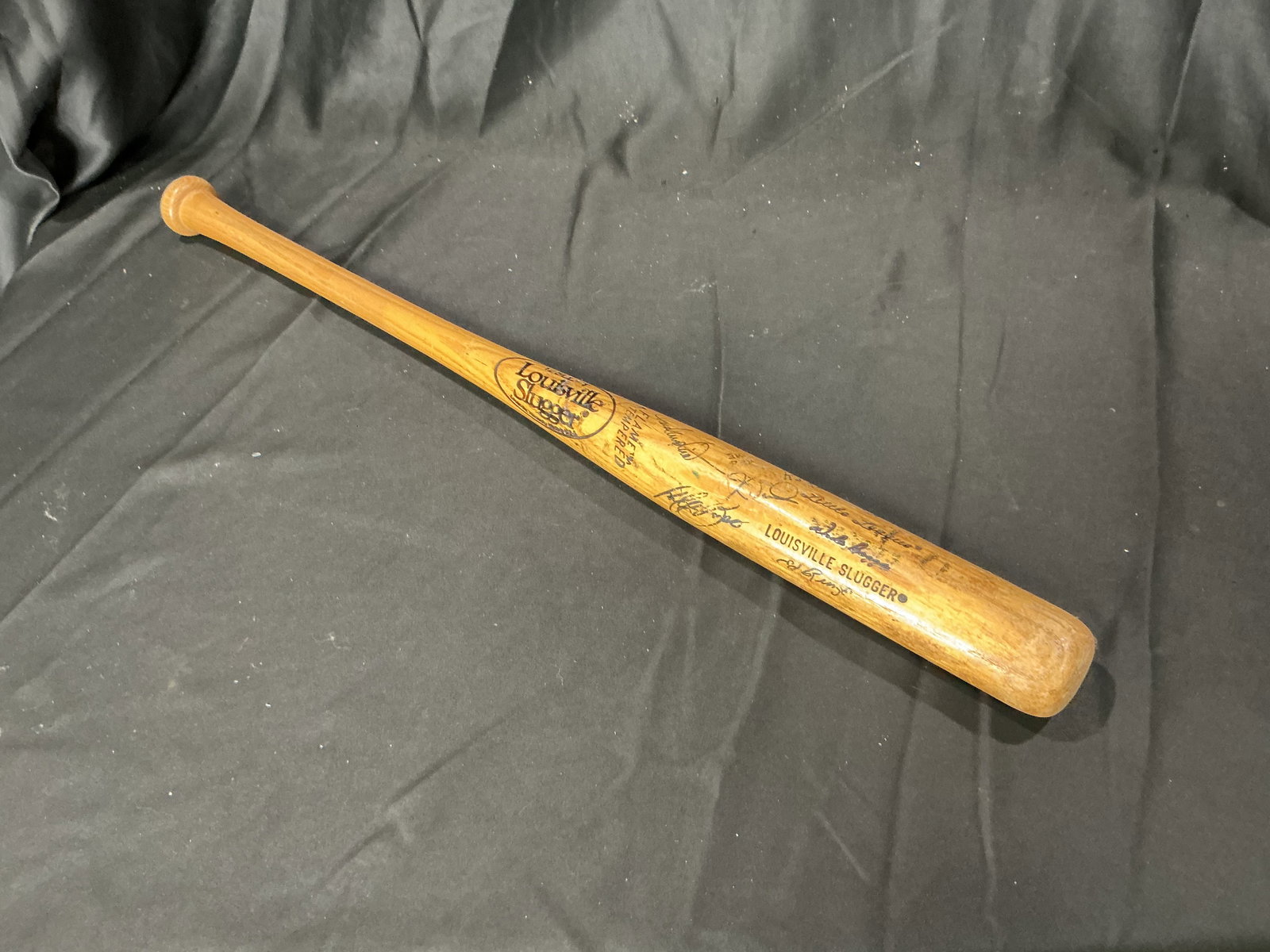 Vintage Louisville Slugger Little League Multi-Signed Baseball Bat: Vintage Louisville Slugger Little League baseball bat featuring numerous player signatures and inscriptions. Attractive display piece with strong baseball memorabilia appeal. Offered as a returning