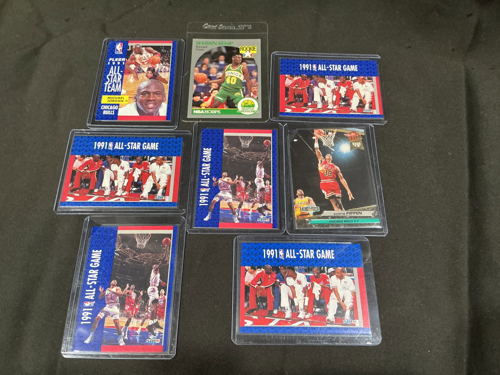 Michael Jordan, Shawn Kemp & NBA Star Card Lot: Group of vintage basketball cards highlighted by Michael Jordan and Shawn Kemp, along with Scottie Pippen and multiple 1991 NBA All-Star Game cards. Includes a Shawn Kemp rookie card and Jordan