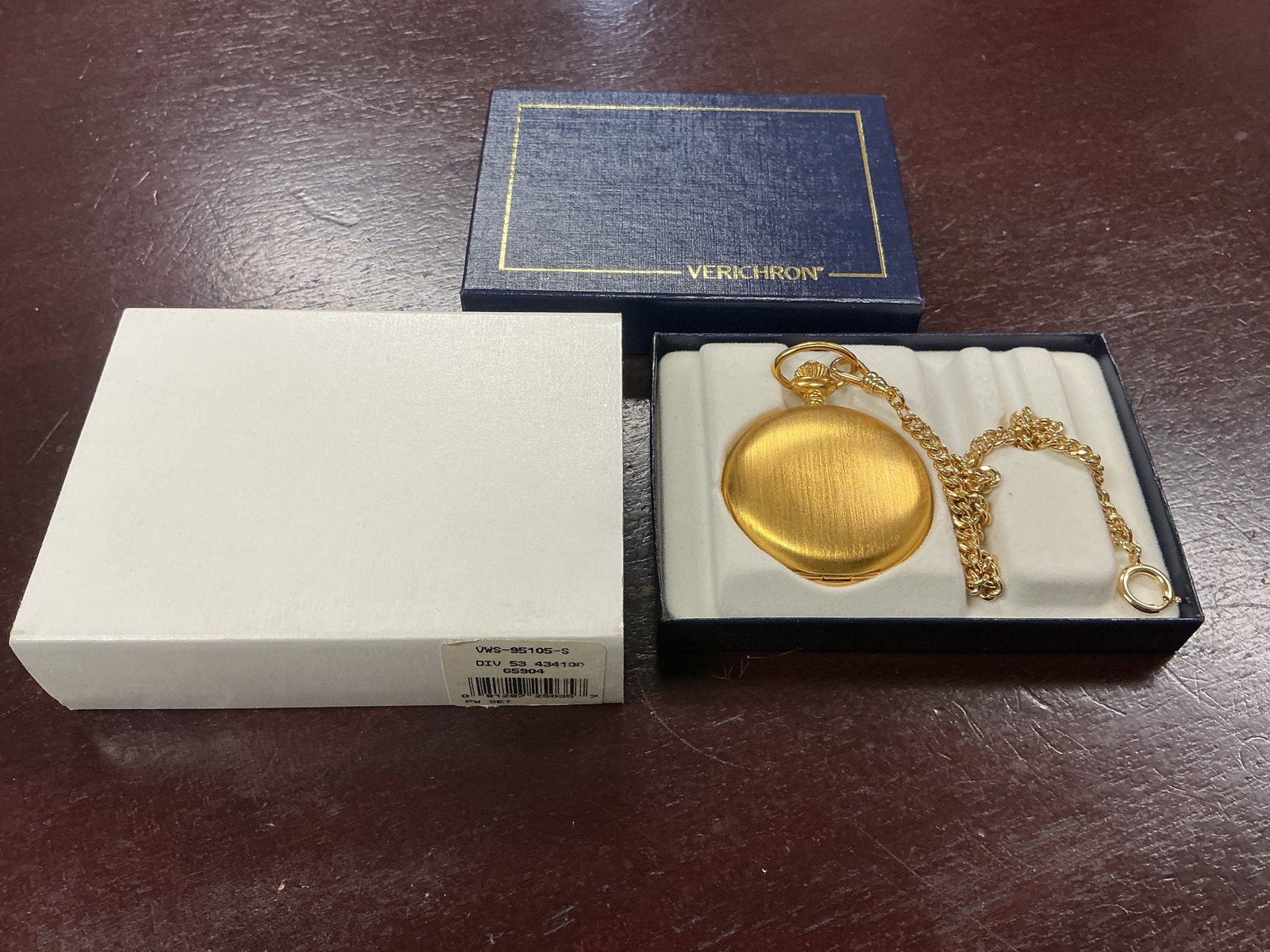 Verichron Pocket Watch w Chain & Box: Verichron quartz pocket watch with chain and presentation box. Includes decorative gold-tone finish and original packaging.