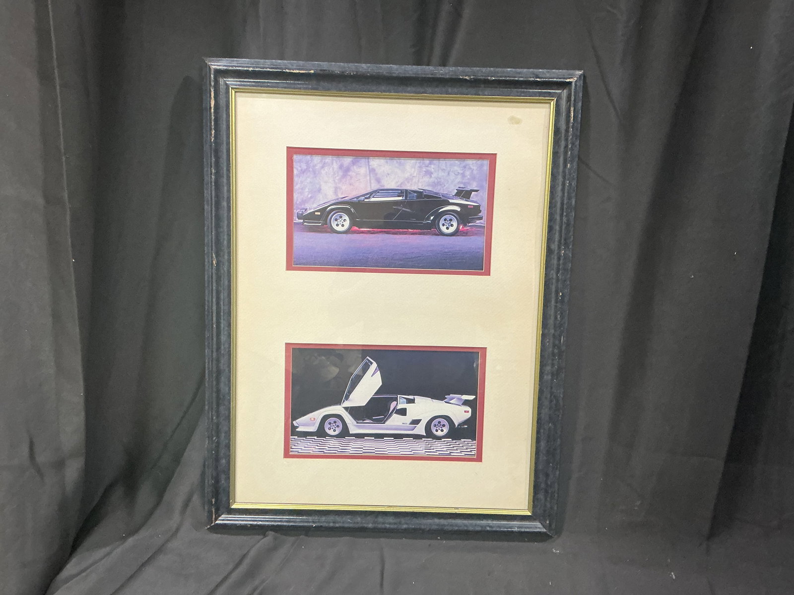 Framed Lamborghini Countach Photo Display: Framed display featuring two Lamborghini Countach photographs including black and white Countach models. Decorative automotive wall display with appeal for Lamborghini enthusiasts and garage decor.