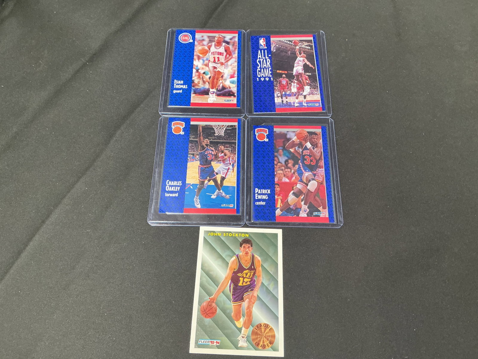 Stockton Ewing Oakley Thomas NBA Card Lot: Group of five vintage NBA cards featuring John Stockton, Patrick Ewing, Charles Oakley, Isiah Thomas, and a 1991 NBA All-Star Game card. Nice mix of Hall of Fame and star player issues from the early
