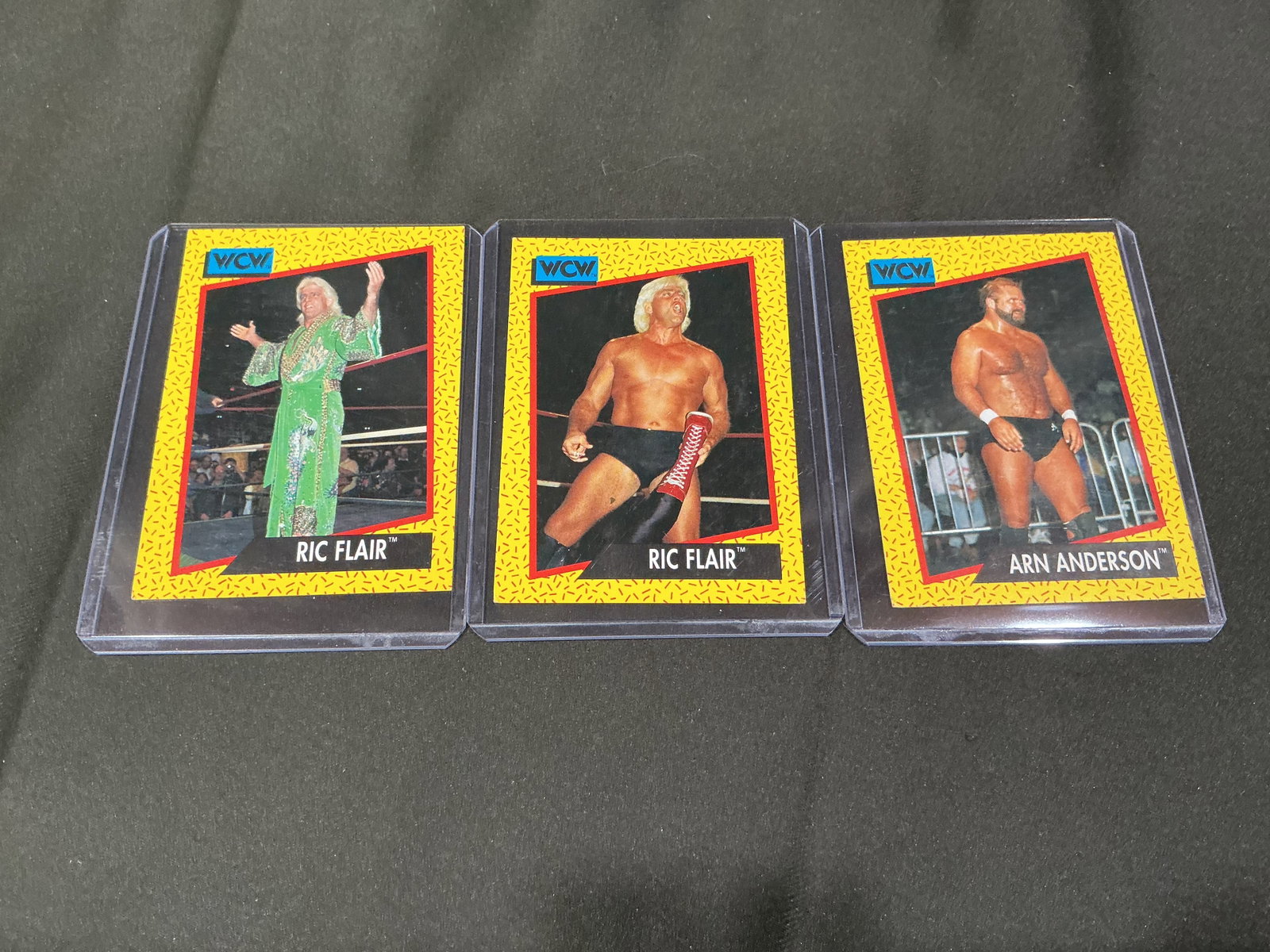 WCW Ric Flair & Arn Anderson Card Lot: Group of vintage WCW wrestling cards featuring Ric Flair and Arn Anderson. Includes multiple Ric Flair cards and Arn Anderson issue with strong appeal for wrestling collectors and fans of the Four Hor